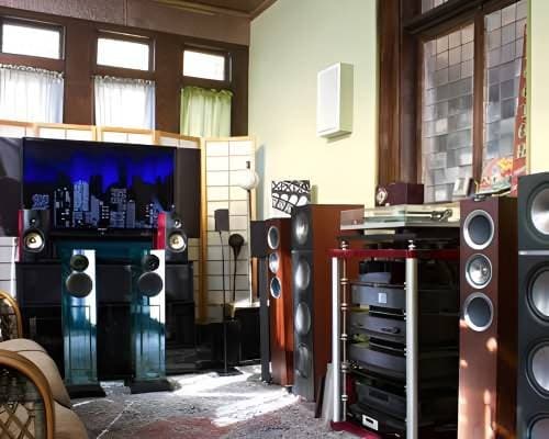 Demonstration room with KEF loudspeakers and stained glass windows